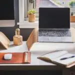 A stylish and contemporary home office setup with laptop and desk accessories.