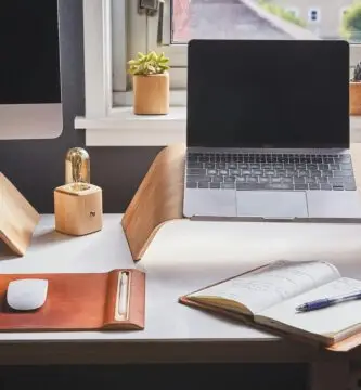 A stylish and contemporary home office setup with laptop and desk accessories.