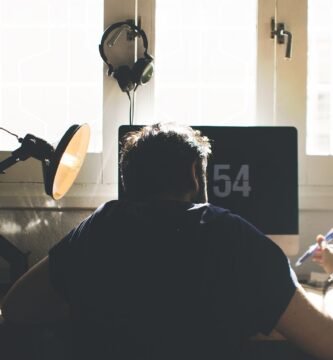 man, chair, computer, desk, sit, seated, electronics, indoors, lamp, laptop, room, workspace, home office, work from home, computer, desk, laptop, room, home office, home office, home office, home office, home office